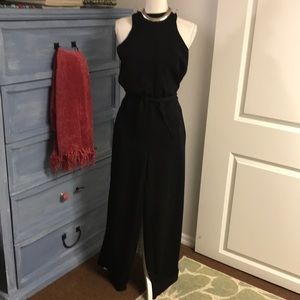 Black spandex and polyester jumpsuit, by Eye Candy. Size small